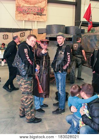 St. Petersburg Russia - 15 April, Bikers with a revolutionary,15 April, 2017.
International Motor Show IMIS-2017 in Expoforurum.
Visitors and participants of the annual moto-salon in St. Petersburg.