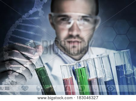 Young scientist mixing reagents in glass flask in clinical laboratory