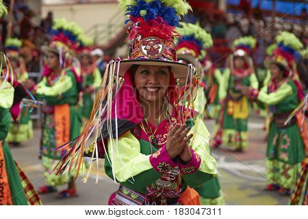 ORURO, BOLIVIA - FEBRUARY 26, 2017: Tinkus dancers in colourful costumes performing at the annual Oruro Carnival. The event is designated by UNESCO as being Intangible Cultural Heritage of Humanity.