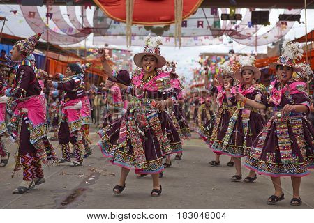 ORURO, BOLIVIA - FEBRUARY 26, 2017: Tinkus dancers in colourful costumes performing at the annual Oruro Carnival. The event is designated by UNESCO as being Intangible Cultural Heritage of Humanity.