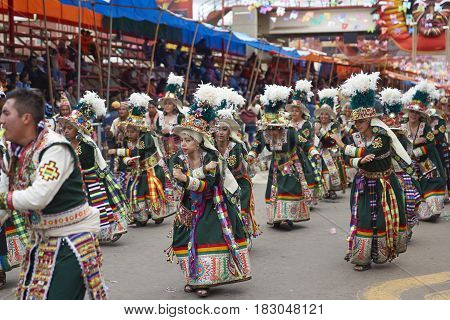 ORURO, BOLIVIA - FEBRUARY 26, 2017: Tinkus dancers in colourful costumes performing at the annual Oruro Carnival. The event is designated by UNESCO as being Intangible Cultural Heritage of Humanity.