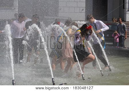 Kiev Ukraine - May 27 2016: Kiev graduates bathing in fountains celebrating the graduation from school