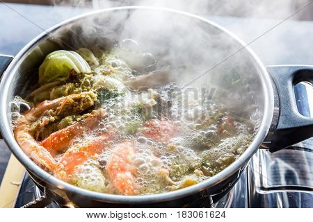 Seafood spicy hot pot crab prawn fish squid tumyum