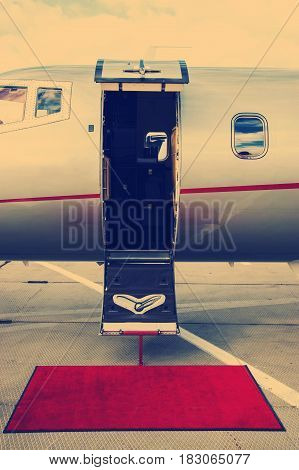 instagram tone corporate Luxury Business Private Jet plane open door at airfield