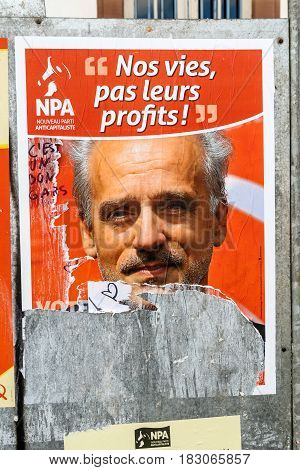 STRASBOURG FRANCE - APR 23 2017: Official campaign posters of Philippe Poutou political party leader of Nouveau Parti anticapitaliste (NPA)