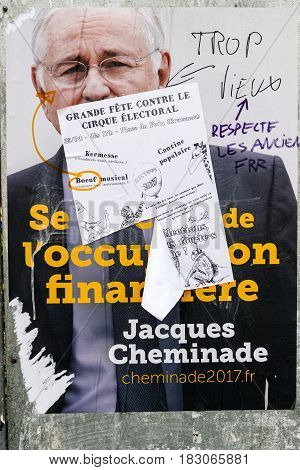 STRASBOURG FRANCE - APR 26 2017: Official campaign posters of Jacques Cheminade political party leader of Solidarité et progres (SP) vandalized on the first round of 2017 French presidential election