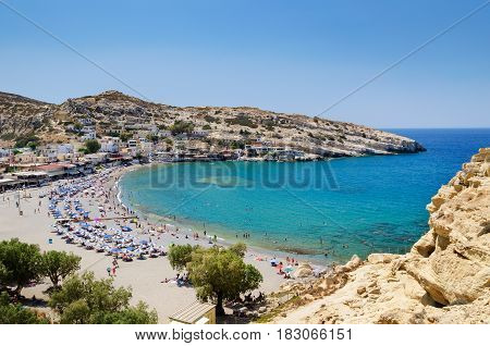 Blue lagoon with sandy beach of Matala town on Crete island, Greece