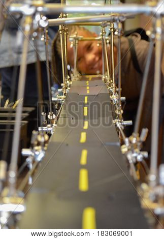 Young African American girl building a bridge with erector set