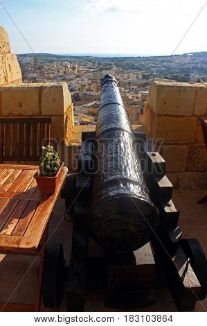 view from the citadel of Mdina Malta to the newer part of the town with cannon