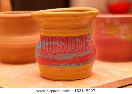 Cay pot painted, pottery craft, moulding the pot with your hands, sculpting hands
