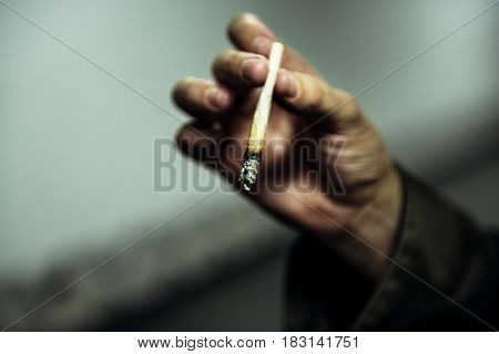 Homeless Man Hand Holding Cigarette