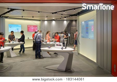 HONG KONG - MAY 05, 5015: people at SmarTone shop. SmarTone Telecommunications Holdings Limited is a wireless communications carrier with operating subsidiaries in Hong Kong and Macau.
