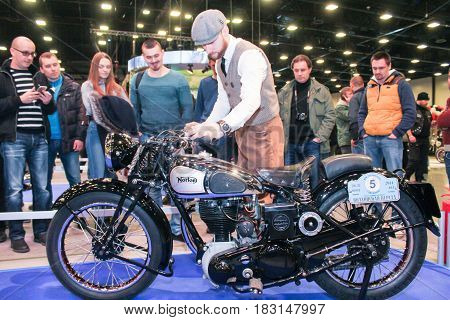 St. Petersburg Russia - 15 April, Mechanic near the motorcycle,15 April, 2017.
International Motor Show IMIS-2017 in Expoforurum.
Visitors and participants of the annual moto-salon in St. Petersburg.