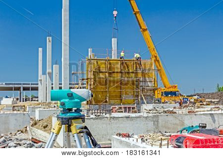Surveyor instrument is for measuring level on construction site. Surveyors ensure precise measurements before undertaking large construction projects.