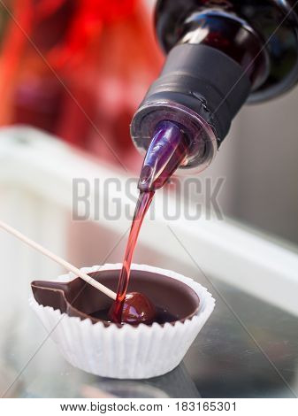 Ginja de Obidos traditional sour cherry liquor served in small cups made of chocolate.