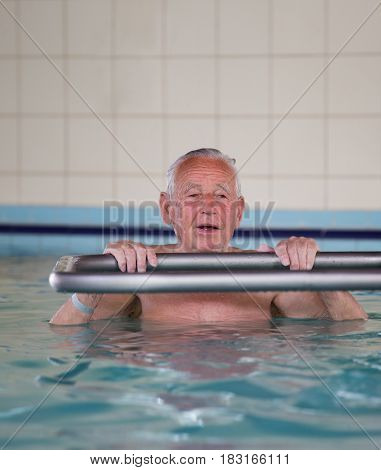 Senior Man In Swimming Pool