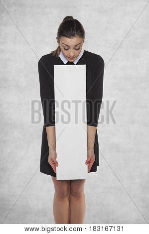 Surprised Woman Looks At An Empty Advertising Spot
