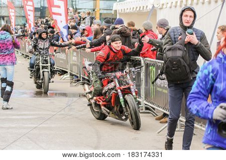 St. Petersburg Russia - 15 April, Greetings from the audience,15 April, 2017.
International Motor Show IMIS-2017 in Expoforurum.
Sports motorcycle show of bikers on the open area.