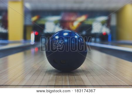 Bowling accessories background. Interior of bowling alley, lane with ball closeup, selective focus