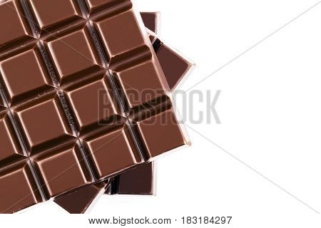 Three pieces of bitter dark chocolate bar isolated on white background close-up top view.