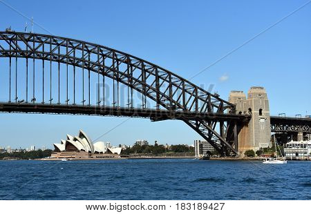 Sydney Australia - Apr 23 2017. Opera House and Harbour Bridge from McMahons Point Ferry Wharf on a sunny day.