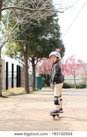 Japanese Boy Riding On A Casterboard (first Grade At Elementary School)