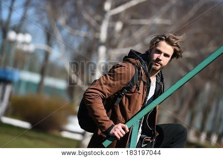 Bearded Man In Brown Hoodie Jacket With Sport Bag