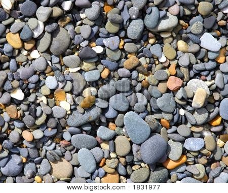 Kiesel auf dem Strand vom Ozean geglättet