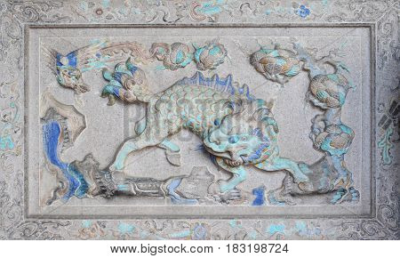 Ancient sculpture of anmial on Chinese temple wall Penang Malaysia