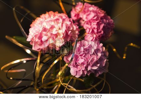 Beautiful flowers background for wedding scene with golden ribbon.