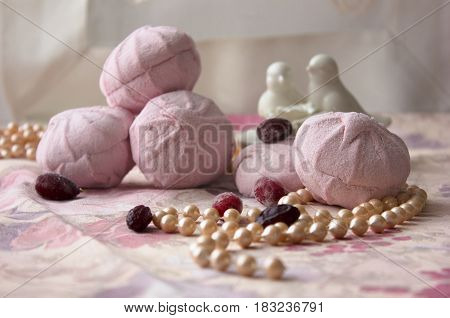 Pink marshmallow on pink cloth. zefir on table