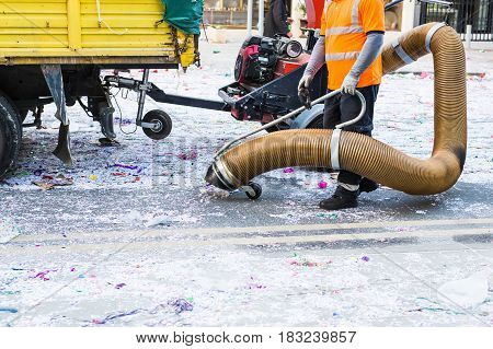 Street cleaner with industrial vacuum cleaner. Municipal cleaning service, clean streets