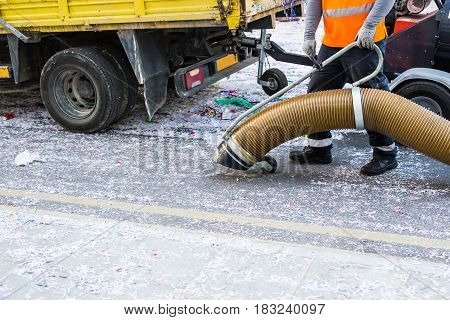 Street cleaner with industrial vacuum cleaner. Municipal cleaning service, clean streets