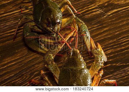 Live Crawfish On A Wooden Board