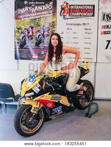 St. Petersburg Russia - 15 April, The girl on motobike,15 April, 2017.
International Motor Show IMIS-2017 in Expoforurum.
Models on motorcycles presented at the motor show.