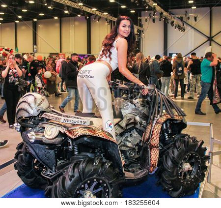 St. Petersburg Russia - 15 April, A fashion model on an ATV,15 April, 2017.
International Motor Show IMIS-2017 in Expoforurum.
Models on motorcycles presented at the motor show.