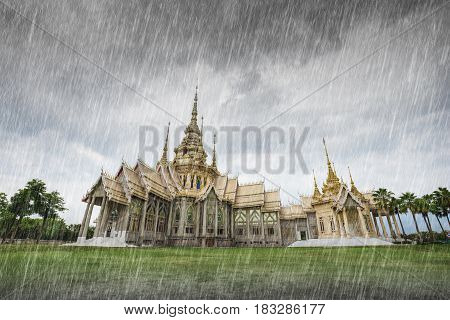 Wat Luang Pho Toh temple with falling rain in Nakhon Ratchasima province Thailand