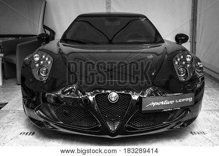 BERLIN - JUNE 14 2015: Sports car Alfa Romeo 4C (since 2014). Black and white. The Classic Days on Kurfuerstendamm.