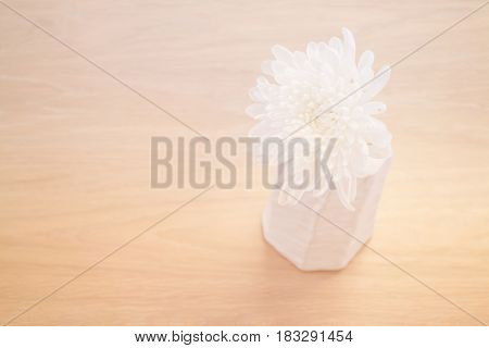 Contemporary Wooden Table With White Flower stock photo
