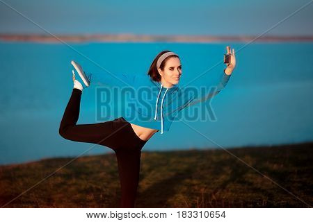 Girl in Yoga Pose Taking a Selfie Outside in Nature