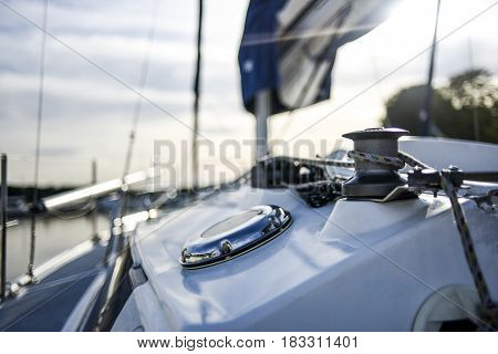 Capstan with line on a sailboat with white background.