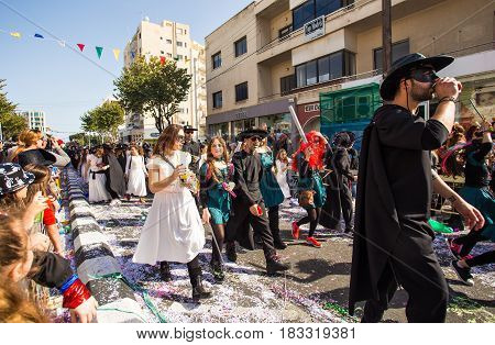 LIMASSOL, CYPRUS - FEBRUARY 26: Grand Carnival Parade - an unidentified people of all ages , gender and nationality in colorful costumes during the street carnival