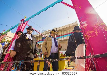 LIMASSOL, CYPRUS - FEBRUARY 26: Grand Carnival Parade - an unidentified people of all ages , gender and nationality in colorful costumes during the street carnival