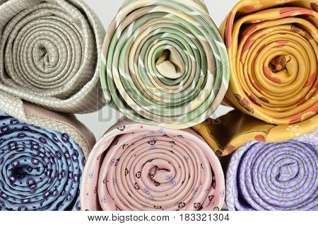 Closeup roll of colorful neck ties isolated