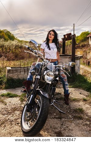 Beautiful Motorcycle Brunette Woman With A Classic Motorcycle (cinema Bleach Bypass Effect)