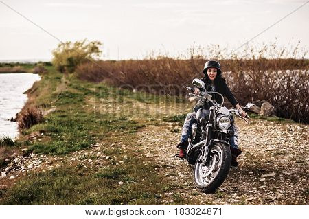 Beautiful Motorcycle Brunette Woman With A Classic Motorcycle (cinema Bleach Bypass Effect)