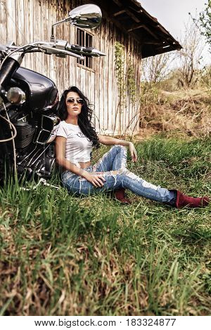 Beautiful Motorcycle Brunette Woman With A Classic Motorcycle (cinema Bleach Bypass Effect)