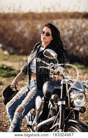 Beautiful Motorcycle Brunette Woman With A Classic Motorcycle (cinema Bleach Bypass Effect)