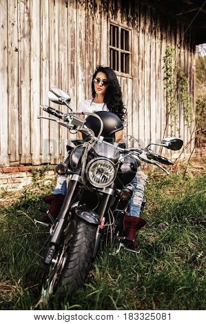 Beautiful Motorcycle Brunette Woman With A Classic Motorcycle (cinema Bleach Bypass Effect)