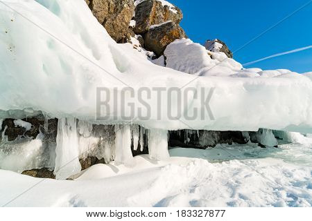 Ice cave with icicles at the mountain in Lake Baikal Russia